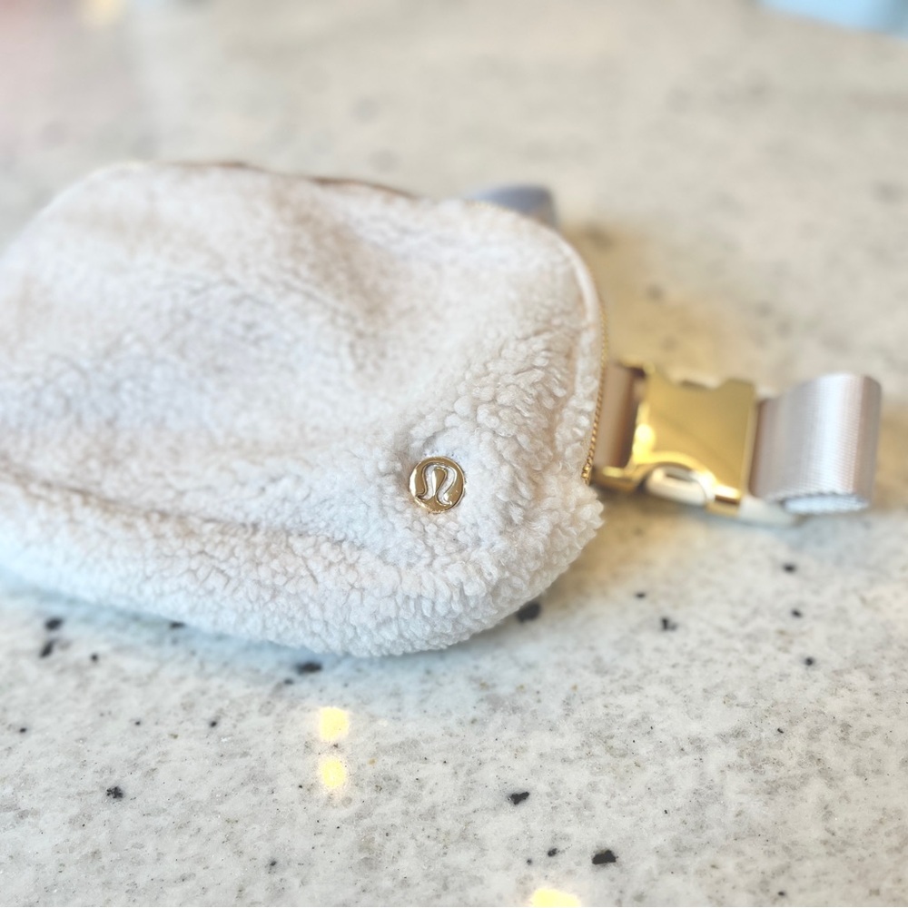 Lululemon Off-White Fleece Pouch with Gold Hardware